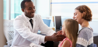 Doctor examining child wellchild exam