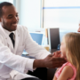 Doctor examining child wellchild exam