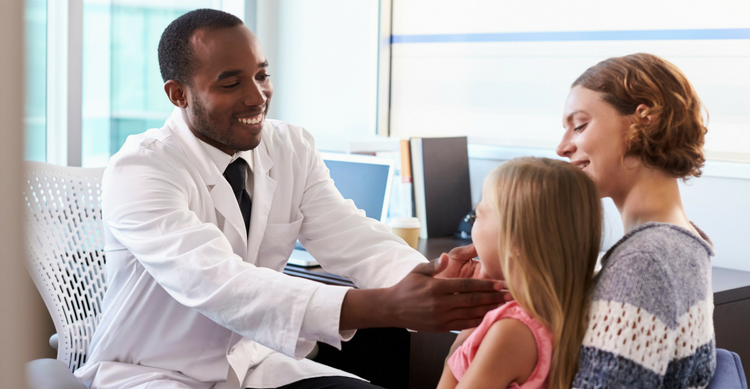 Doctor examining child wellchild exam