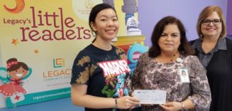 Legacy’s “Little Readers” celebrates Disney grant with commemorative for pediatric patients.