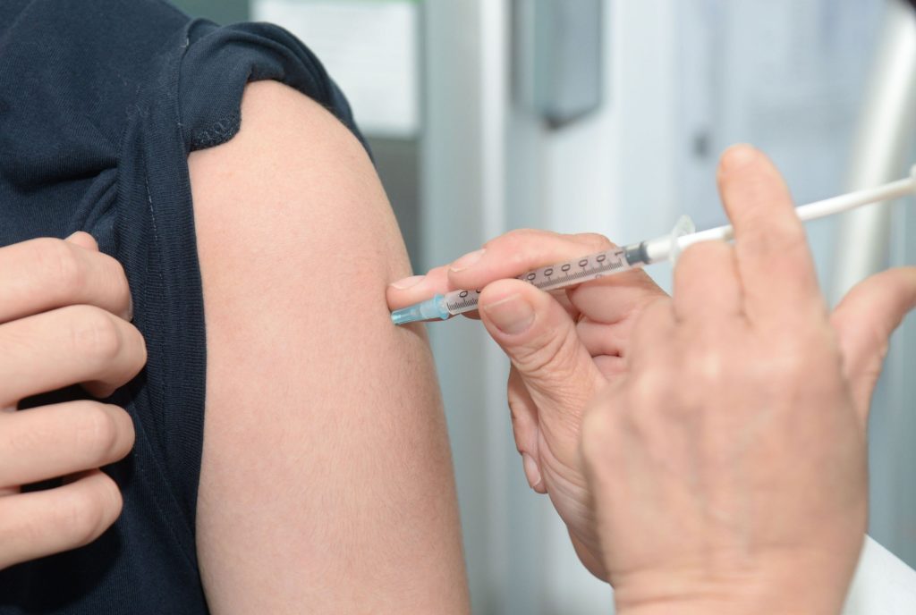 getting a vaccination in the arm