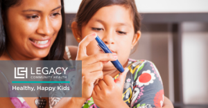 Child holding a blood glucose meter with an adult nearby, promoting diabetes awareness and healthy habits. Legacy Community Health logo with the tagline ‘Healthy, Happy Kids’ displayed in the corner.