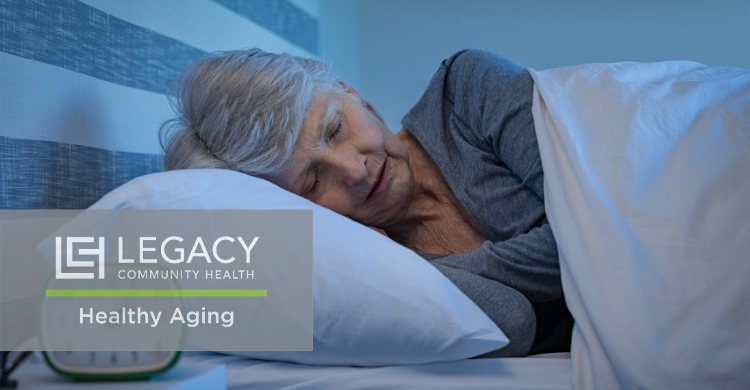 Older woman sleeping peacefully in bed with a Legacy Healthy Aging overlay.